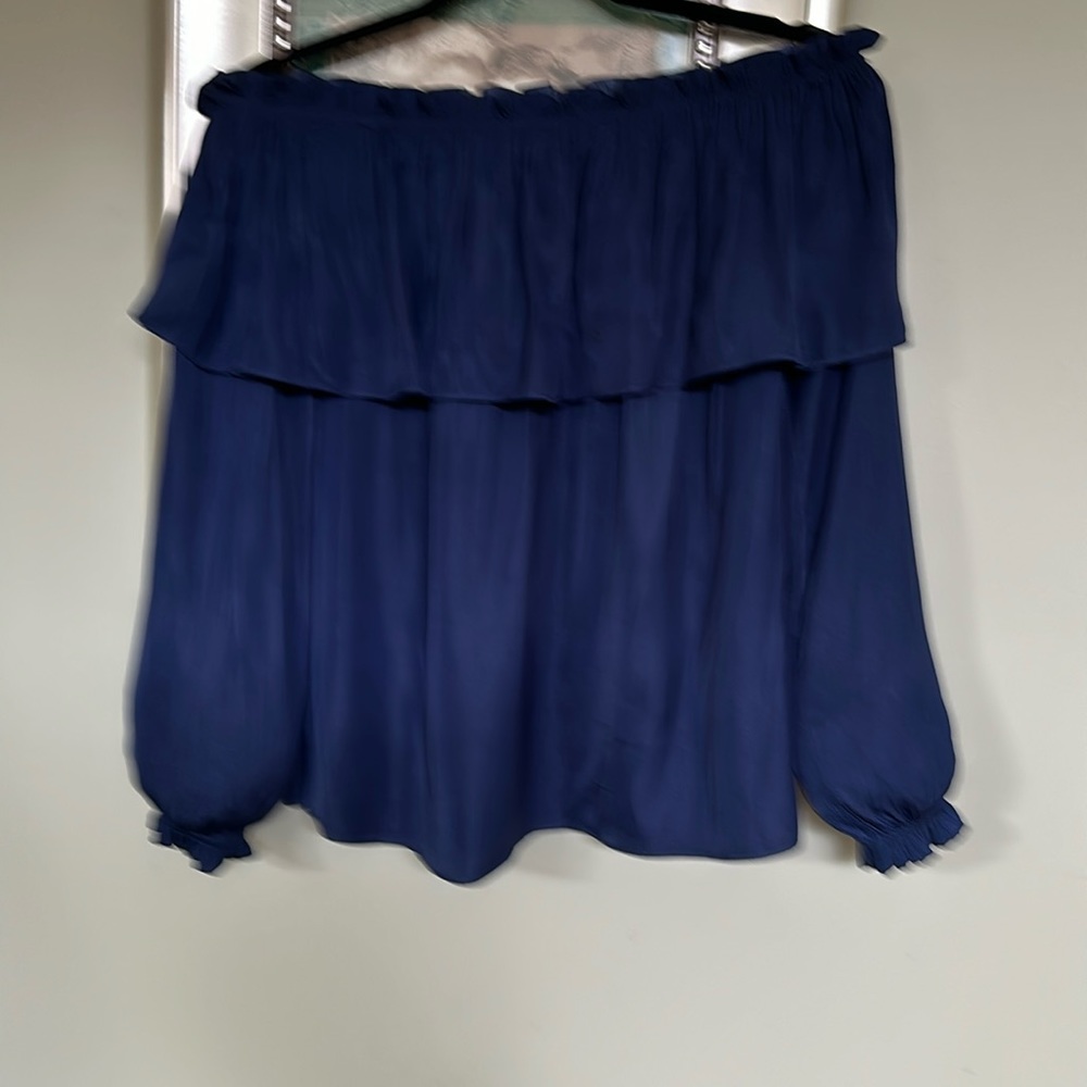 It’s a polyester silk navy, very attractive on like new